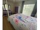Bright bedroom with double bed, dresser, and large window at 4260 Climbing Aster Ct, Saint Cloud, FL 34772