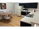 Cozy kitchen with dark cabinets, white countertops, and a breakfast nook at 4260 Climbing Aster Ct, Saint Cloud, FL 34772