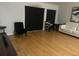 Living room with hardwood floors, neutral walls, and comfortable seating at 4260 Climbing Aster Ct, Saint Cloud, FL 34772