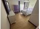 Bedroom with a light purple dresser, post bed, and light floors at 4260 Climbing Aster Ct, Saint Cloud, FL 34772