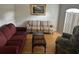 Cozy living room with two sofas, coffee table, and hardwood floors at 4260 Climbing Aster Ct, Saint Cloud, FL 34772