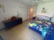 bedroom with dinosaur-themed decor and ample closet space at 4260 Climbing Aster Ct, Saint Cloud, FL 34772