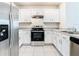 Modern kitchen with stainless steel appliances at 2222 Elmsford Pt, Sanford, FL 32771