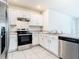 White cabinets and stainless steel appliances at 2222 Elmsford Pt, Sanford, FL 32771