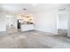 Bright and spacious living room with carpeted floors and an open floor plan at 2222 Elmsford Pt, Sanford, FL 32771