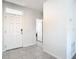 Front entry with tile floors and interior door at 2222 Elmsford Pt, Sanford, FL 32771
