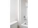 Simple bathroom with white tile shower and tub at 2222 Elmsford Pt, Sanford, FL 32771