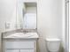 Clean bathroom with single vanity, mirror and shower/tub combo at 2222 Elmsford Pt, Sanford, FL 32771