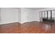 Bright living room with hardwood floors and sliding glass doors at 954 Courtyard Ln # 11, Orlando, FL 32825