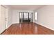 Living room with hardwood floors and access to patio at 954 Courtyard Ln # 11, Orlando, FL 32825