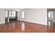 Spacious living area featuring hardwood floors and access to a balcony at 954 Courtyard Ln # 11, Orlando, FL 32825