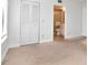 Bedroom with neutral carpeting and en-suite bathroom at 954 Courtyard Ln # 11, Orlando, FL 32825