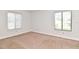 Spacious bedroom with neutral carpeting and large windows at 954 Courtyard Ln # 11, Orlando, FL 32825