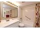 Clean bathroom with a shower/tub combo, white vanity, and updated fixtures at 954 Courtyard Ln # 11, Orlando, FL 32825