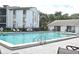 Refreshing community pool with ample lounge chairs at 954 Courtyard Ln # 11, Orlando, FL 32825