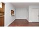 Kitchen pass-through and hardwood flooring at 954 Courtyard Ln # 11, Orlando, FL 32825