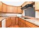 Well-equipped kitchen with wood cabinets and granite countertops at 954 Courtyard Ln # 11, Orlando, FL 32825