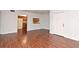 Living room with hardwood floors and kitchen pass-through at 954 Courtyard Ln # 11, Orlando, FL 32825