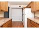 Kitchen with wood cabinets and appliances at 954 Courtyard Ln # 11, Orlando, FL 32825