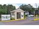 Gated community entrance with guard house and signage at 954 Courtyard Ln # 11, Orlando, FL 32825
