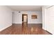 Open living area showcasing hardwood floors and kitchen view at 954 Courtyard Ln # 11, Orlando, FL 32825
