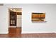 Galley kitchen with wood cabinets and pass-through to living area at 954 Courtyard Ln # 11, Orlando, FL 32825