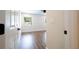 Bright bedroom with wood-look floors and a ceiling fan at 1124 Munster St, Orlando, FL 32803