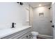 Updated bathroom with modern vanity and walk-in shower at 1124 Munster St, Orlando, FL 32803