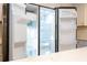 Open refrigerator showcasing ample storage space at 1124 Munster St, Orlando, FL 32803