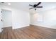 Well-lit bedroom featuring wood-look floors and a window with blinds at 1124 Munster St, Orlando, FL 32803