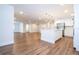 Modern kitchen with white cabinets, island, and stainless steel appliances at 1124 Munster St, Orlando, FL 32803