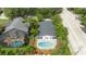 House with a backyard pool, next to another house with a pool at 1124 Munster St, Orlando, FL 32803