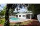 Inviting kidney-shaped pool in backyard at 1124 Munster St, Orlando, FL 32803