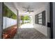 Covered patio with ceiling fan, adjacent to pool at 1124 Munster St, Orlando, FL 32803