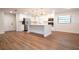 Updated kitchen featuring white cabinets, stainless steel appliances, and an island at 1124 Munster St, Orlando, FL 32803