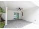 Covered patio with a ceiling fan and sliding glass doors at 1124 Munster St, Orlando, FL 32803