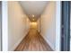 Bright hallway with wood-look floors leading to other rooms at 1124 Munster St, Orlando, FL 32803