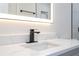 Modern bathroom vanity with quartz countertop and black matte faucet at 1124 Munster St, Orlando, FL 32803