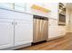 Stainless steel dishwasher built into white cabinets at 1124 Munster St, Orlando, FL 32803