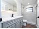 Modern bathroom with gray vanity, quartz countertop, and a walk-in shower at 1124 Munster St, Orlando, FL 32803