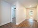 Hallway with wood-look floors and access to other rooms at 1124 Munster St, Orlando, FL 32803