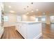 White kitchen island with quartz countertop and pendant lights at 1124 Munster St, Orlando, FL 32803