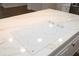 White GE cooktop with four heating elements on a quartz countertop at 1124 Munster St, Orlando, FL 32803