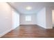 Bright living room with wood-look floors and sliding door at 1124 Munster St, Orlando, FL 32803