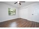 Light and airy bedroom featuring wood-look floors and a large closet at 1124 Munster St, Orlando, FL 32803