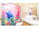 Bathroom with Trolls-themed shower curtain and single vanity at 441 Montara Dr, Davenport, FL 33897