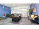 Game room with pool table, foosball table, and seating area at 441 Montara Dr, Davenport, FL 33897