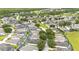 Aerial view of houses and green spaces in a residential area at 441 Montara Dr, Davenport, FL 33897