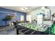 Game room with pool table, foosball table, and kitchenette at 441 Montara Dr, Davenport, FL 33897