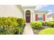 Single-Gathering home with red shutters and a welcoming entrance at 441 Montara Dr, Davenport, FL 33897